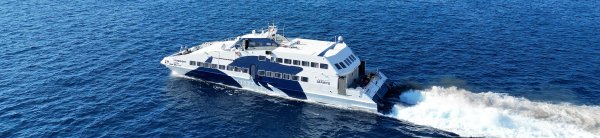 The small high-speed ferry Super Jet of Seajets leavig the port of Santorini